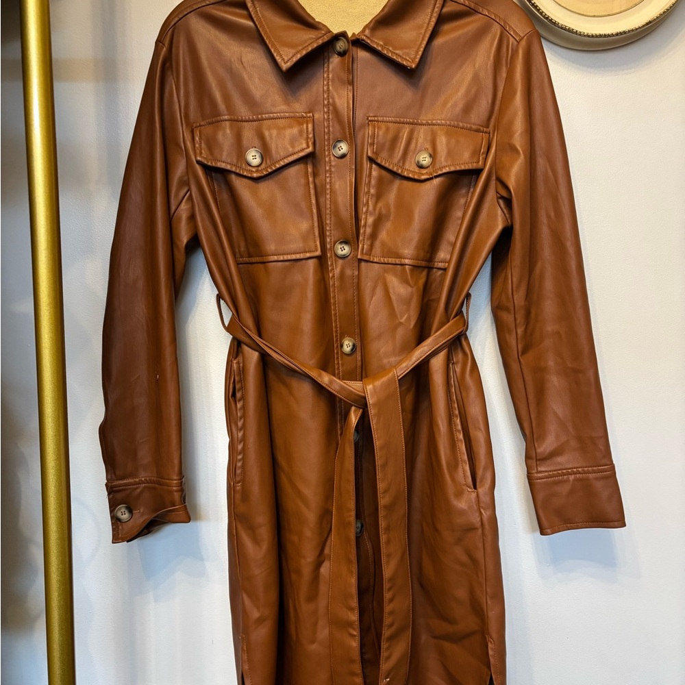 Faux leather duster but can be worn as a dress. Some damage as shown in photos